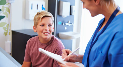 a boy talking to a doctor